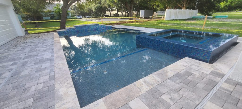 Custom pool and spa with landscaping construction | Winway Pools