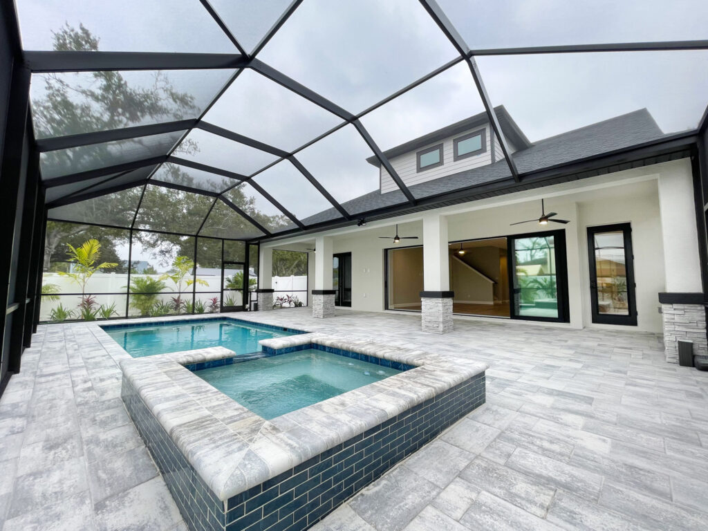 Poolhouse beside a custom pool with wire mesh cover | Winway Pools
