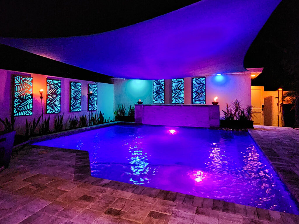Custom pool with purple lighting and stain glass windows | Winway Pools