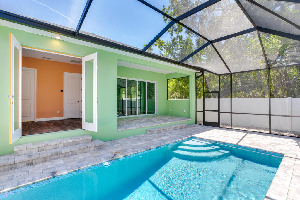 Custom pool steps under glass canopy | Winway Pools