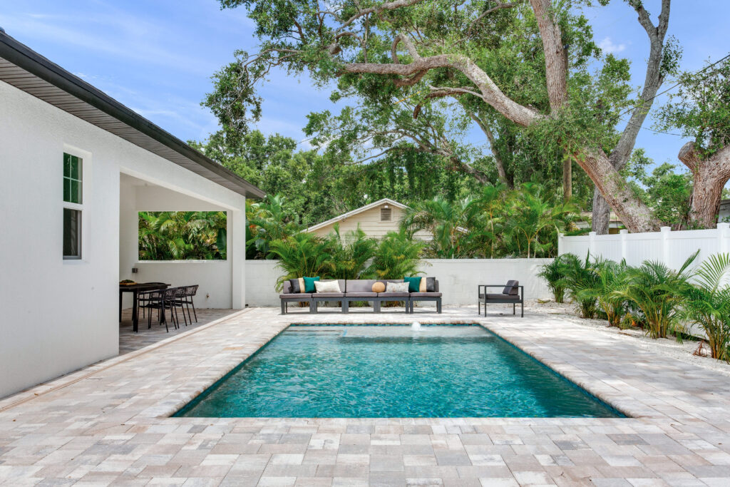 Custom pool and patio with furniture | Winway Pools