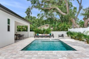 Custom pool in backyard with paver patio | Winway Pools