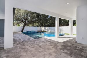 Custom pool with spa on a paver deck | Winway Pools