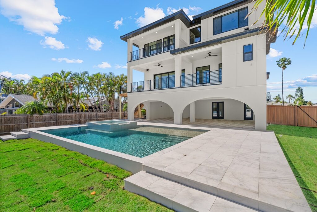 Custom pool built with custom home from Winway Pools.