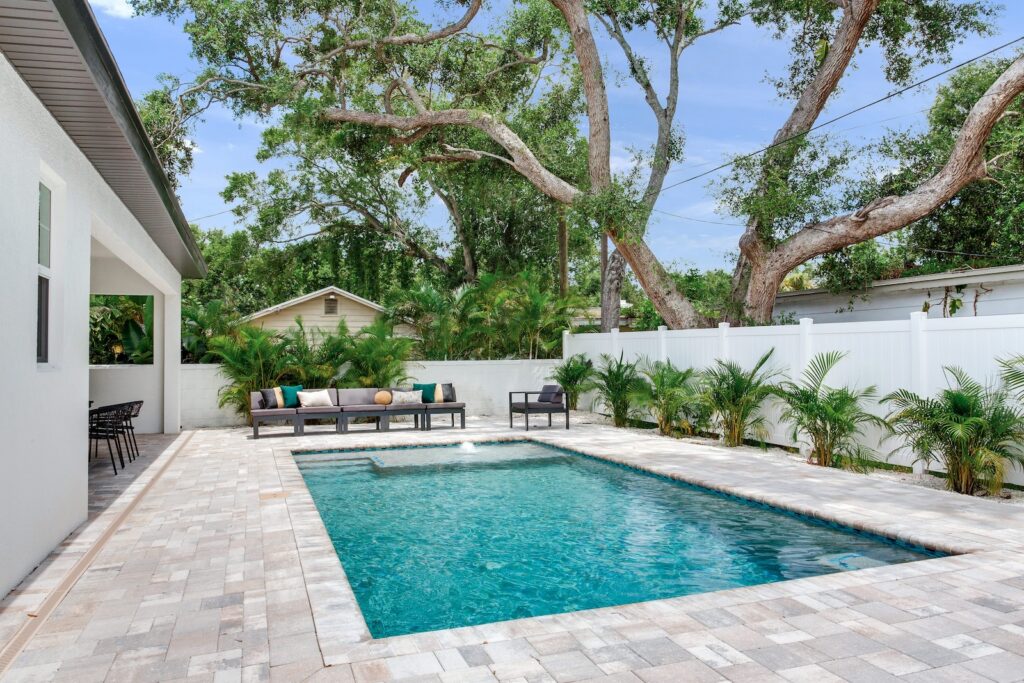 Aerial shot of custom pool with pavers