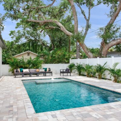 Aerial shot of custom pool with pavers