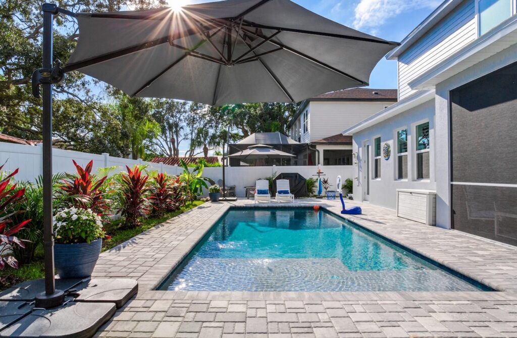 Photo of Beautiful, Recently-Installed Custom Pool with Umbrella