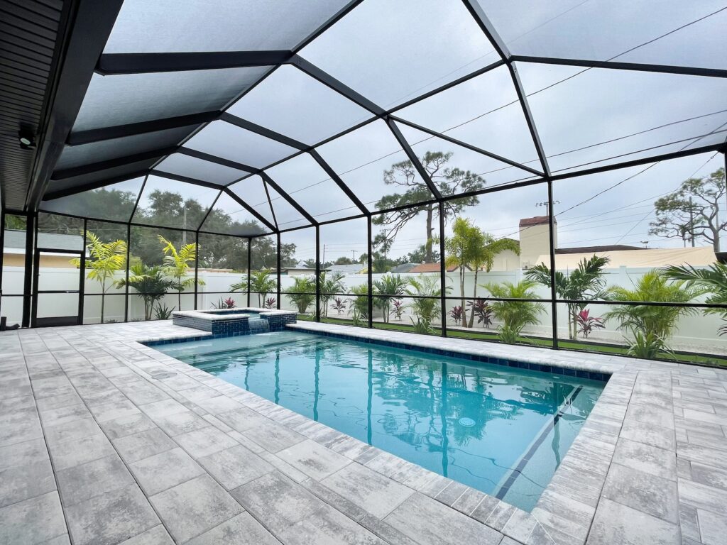 Stunning Custom Pool and Spa, Patio with Transparent Cover with View of Landscaping by WinWay Pools